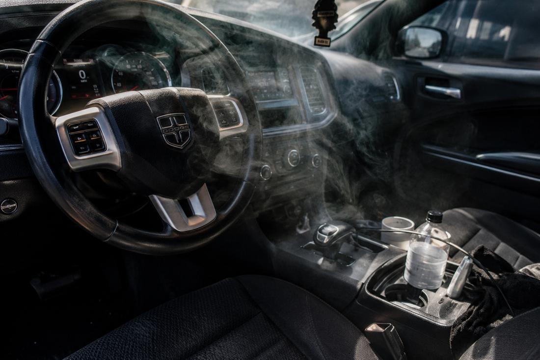 Car interior with lingering odor — illustrating why air fresheners don't solve the problem